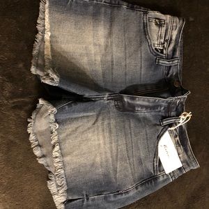 Jean shorts with frayed edges.  NWT.